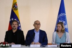 United Nations High Commissioner for Human Rights (OHCHR) Volker Turk looks on next to Human Rights Reporting Officer Helene Devaux, and Jose M. Aranaz during a news conference in Caracas, Venezuela, Jan. 28, 2023.