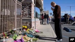 FILE - Kenny Loo, 71, prays outside Star Ballroom Dance Studio for the victims killed in Saturday's shooting in Monterey Park, Calif., Jan. 23, 2023.