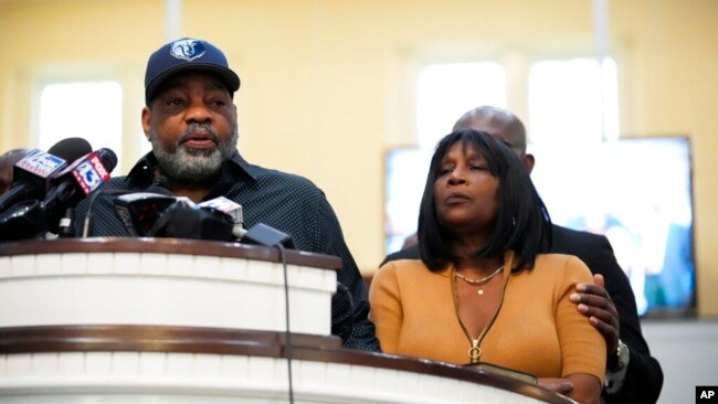 Rodney Wells, stepfather of Tyre Nichols, who died after being beaten following a traffic stop, speaks at a news conference with civil rights attorney Ben Crump, seen comforting Tyre's mother, RowVaughn Wells, in Memphis, Tenn., Jan. 27, 2023.
