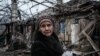Lidiya Malyovana, 76, reacts at her house destroyed by a rocket overnight as the sounds of gunshots and artillery continue in the distance in Chasiv Yar, Donetsk region, Ukraine, on Jan. 28, 2023. 