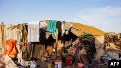 FILE - A general view of a makeshift shelter at the Faladie internally displaced people (IDP) camp in Bamako, Nov. 9, 2022. - People fleeing a decade-long conflict in Mali take refuge at the Faladie IDP camp. 