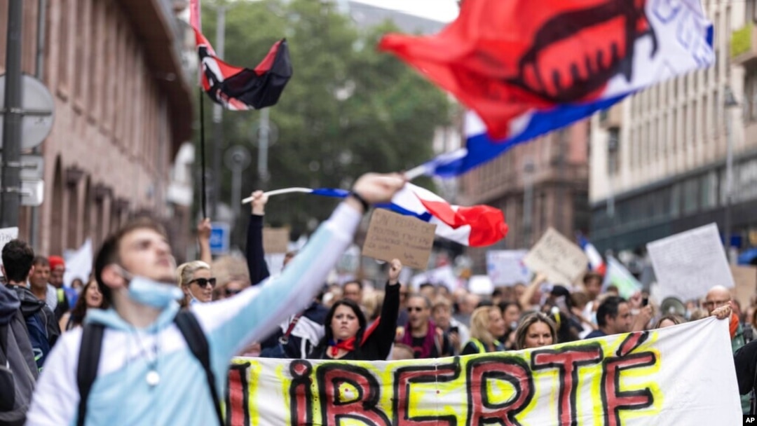 Anti-vaccine protesters march during a rally in Strasbourg, France, July 17, 2021. Tens of thousands of people protested across France on Saturday against the government's latest measures to curb rising COVID-19 infections.