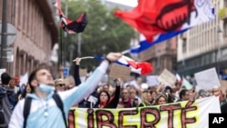 Anti-vaccine protesters march during a rally in Strasbourg, France, July 17, 2021. Tens of thousands of people protested across France on Saturday against the government's latest measures to curb rising COVID-19 infections.