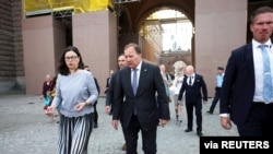 Sweden's Prime Minister Stefan Lofven and Minister of Education Anna Ekstrom walk after the no-confidence vote in the Swedish parliament, in Stockholm, Sweden June 21, 2021. (TT News Agency/Nils Petter Nilsson via Reuters)