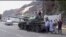 This frame grab from video shows fighters loyal to the separatist so-called Southern Transitional Council, backed by the United Arab Emirates, near the presidential palace, in Aden Yemen, Tuesday, Jan. 30, 2018. 