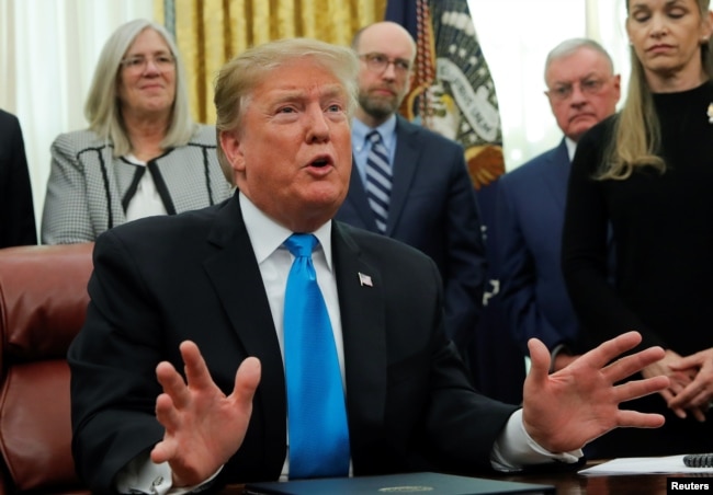 U.S. President Donald Trump speaks in the Oval Office at the White House in Washington, Feb. 19, 2019.