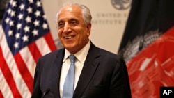 FILE - Special Representative for Afghanistan Reconciliation Zalmay Khalilzad approaches the microphone to speak on the prospects for peace, Feb. 8, 2019, at the U.S. Institute of Peace, in Washington.