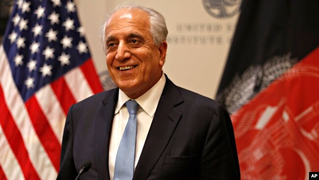 FILE - Special Representative for Afghanistan Reconciliation Zalmay Khalilzad approaches the microphone to speak on the prospects for peace, Feb. 8, 2019, at the U.S. Institute of Peace, in Washington.