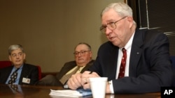 FILE - Dr. Donald Henderson speaks at the University of Arkansas for Medical Sciences about the risks of bioterrorism, Little Rock, Arkansas, Dec. 11, 2003. 