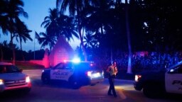 Police direct traffic outside an entrance to former President Donald Trump's Mar-a-Lago estate, in Palm Beach, Fla., Aug. 8, 2022.