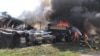 This handout picture taken and released by the Ukrainian Emergency Service on Aug. 8, 2022, shows firefighters working to put out a fire after a missile was shot down and landed on civilian infrastructure in Uman district. 