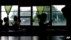 Students attend a class at Chalmers Elementary school in Chicago, Wednesday, July 13, 2022. (AP Photo/Nam Y. Huh)