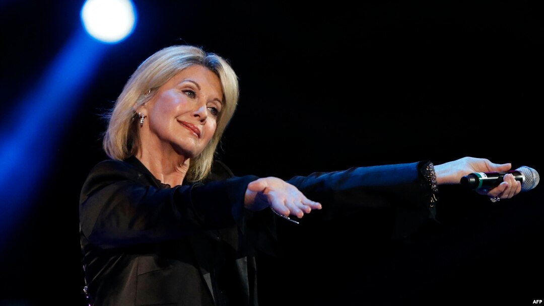 FILE - Singer Olivia Newton-John performs at the 58th Vina del Mar International Song Festival in Vina del Mar, Chile, Feb. 23, 2017.