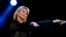 FILE - Singer Olivia Newton-John performs at the 58th Vina del Mar International Song Festival in Vina del Mar, Chile, Feb. 23, 2017.