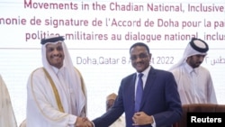 Qatar's Deputy PM and Foreign Minister Sheikh Mohammed bin Abdulrahman al-Thani shakes hands with Chad's Foreign Minister Mahamat Zene Cherif during a signing agreement for a national dialogue with Chad's transitional military authorities and rebels in Doha, Aug. 8, 2022.