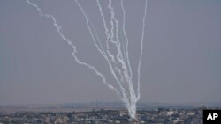 Rockets are launched from the Gaza Strip towards Israel, in Gaza City, Aug. 6, 2022.