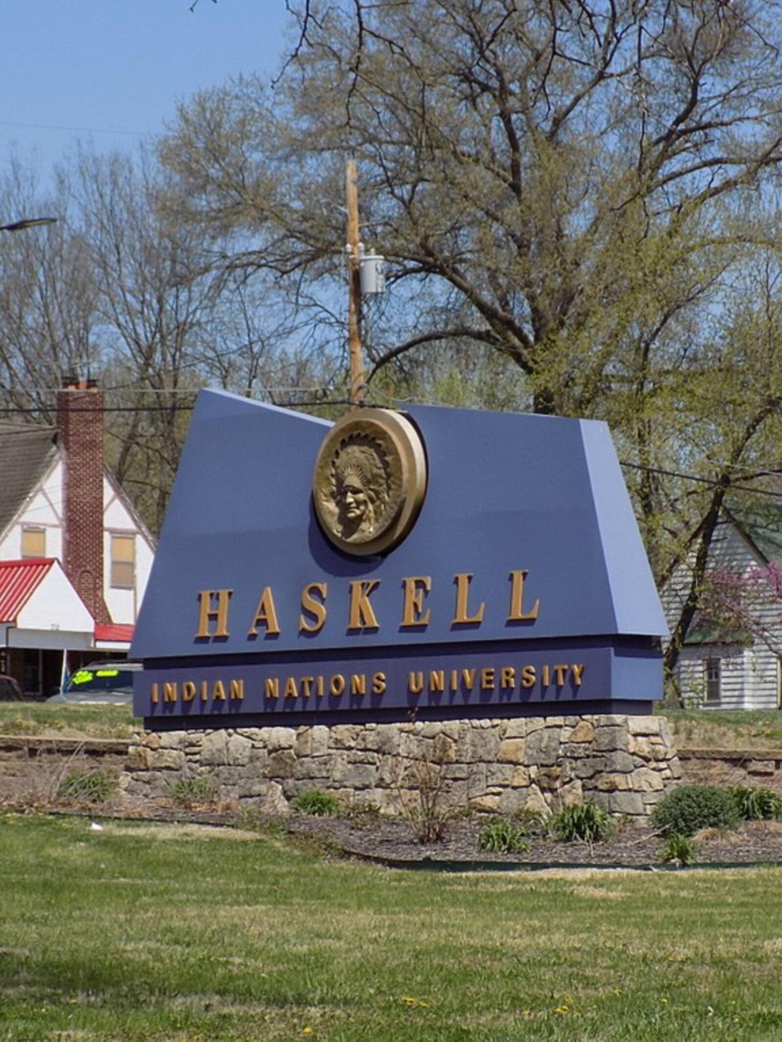 Sign at the entrance of Haskell Indian Nations University, a public tribal land-grant university in Lawrence, Kansas, founded in 1884.