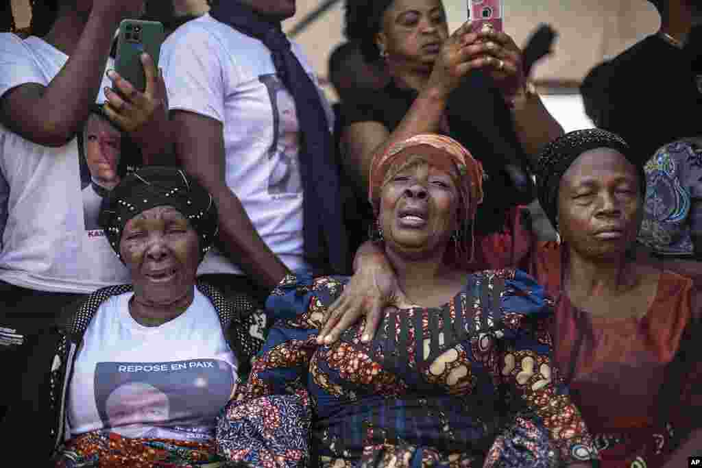 Mourners gather around coffins containing the remains of residents who died during protests against the United Nations mission to the Democratic Republic of Congo in Goma.