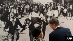 U.S. Secretary of State Antony Blinken, right, speaks on August 7, 2022, with Antoinette Sithole, the sister of late Hector Pieterson, who was killed at age 12 during the Soweto uprising.