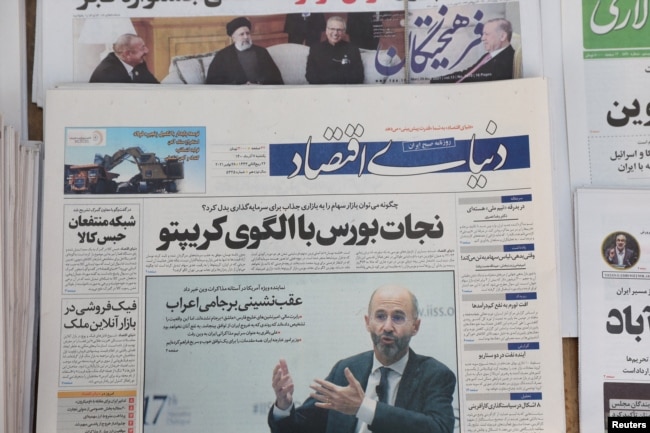 FILE - A newspaper with a cover picture of U.S. Special Representative for Iran Robert Malley is seen in Tehran, Iran, Nov. 29, 2021. (Majid Asgaripour/WANA via Reuters)