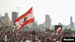 FILE - People gather during a protest marking the two-year anniversary of the August 2020 Beirut port blast, in Beirut, Lebanon, Aug. 4, 2022. 