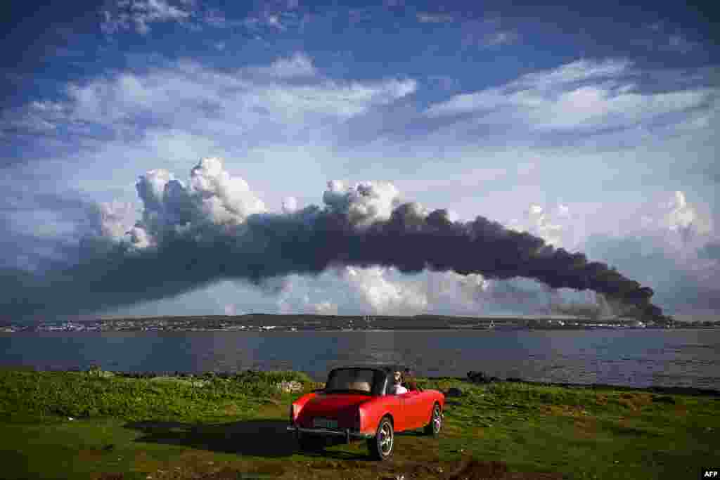 Black smoke from oil tanks on fire is seen near the Matanzas bay, Cuba.&nbsp;Planes carrying products, firefighters and specialists from Mexico and Venezuela arrived in Cuba to help put out the fire of two oil tanks, which enters its third day with one dead, 17 missing and 36 hospitalized.