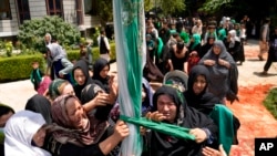 Afghan Shiite Muslims attend a mourning ceremony three days ahead of Ashoura, in a mosque in Kabul, Aug. 5, 2022. A bomb blast Friday near a Shiite gathering in the city killed at least eight civilians and wounded 18 others. 