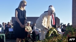 US Deputy Secretary of State Wendy Sherman (C) lays a wreath next to US Ambassador to Australia Caroline Kennedy (L) during a ceremony marking the 80th anniversary of the Battle of Guadalcanal at Skyline Ridge in Honiara on the Solomon Islands on August 7, 2022. (Photo by Charley PIRINGI / AFP)