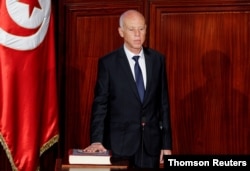 FILE PHOTO: Tunisian President Kais Saied takes the oath of office in Tunis