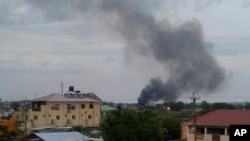 Black smoke is seen rising above South Sudan's capital, Juba, on July 10, 2016. Days of fighting have included attacks on United Nations facilities. The UN says the attacks could be considered war crimes.