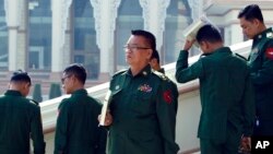 Military representatives leave after attending a regular session of the Union Parliament in Naypyitaw, Myanmar, Jan. 29, 2019. 