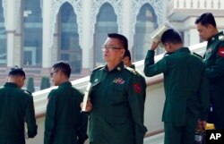 Military representatives leave after attending a regular session of the Union Parliament in Naypyitaw, Myanmar, Jan. 29, 2019.