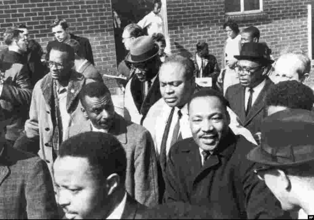 Civil rights leader James Farmer is shown in this undated family photo standing behind the Rev. Martin Luther King, Jr. (AP Photo/HO)