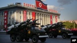FILE - North Korean soldiers parade through Kim Il Sung Square with their missiles and rockets during a mass military parade, Oct. 10, 2015, in Pyongyang, North Korea. 