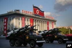 North Korean soldiers parade through Kim Il Sung Square with their missiles and rockets during a mass military parade, Oct. 10, 2015, in Pyongyang, North Korea.