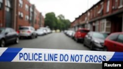 FILE - Police cordon off the road in Rusholme, Manchester, Britain June 2, 2017. 