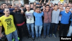 Military policemen protest outside their battalion during a police strike in Vitoria, Brazil, Feb. 10, 2017. 