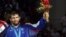 FILE -Gold medalist Sagid Mourtasaliyev (C) poses with silver medallist Islam Bairamukov at the Olympic Games in Sydney on September 30, 2000. 