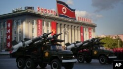 FILE - North Korean soldiers parade through Kim Il Sung Square with their missiles and rockets during a mass military parade.