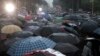 Protesters take part in a rally in Tirana, May 13, 2019. Anti-government protesters in Albania hurled firebombs and flares at riot police standing in front of the main government building.