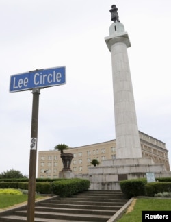 FILE - An 18-meter-tall monument to Confederate General Robert E. Lee towers over a traffic circle in New Orleans, Louisiana.