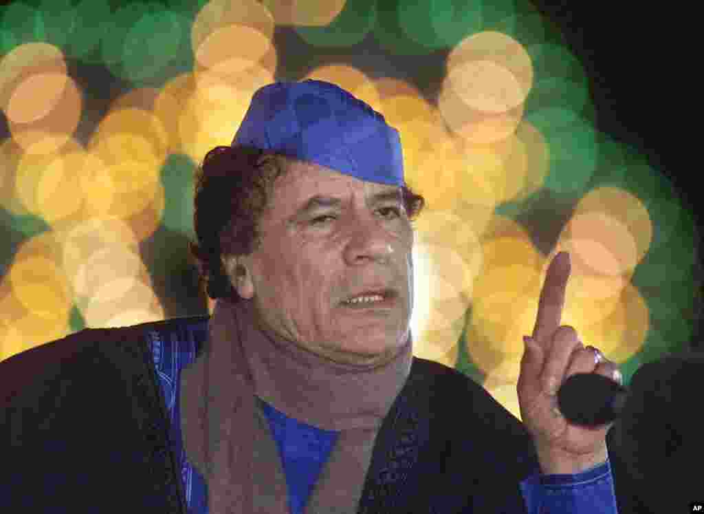 Libyan leader Moammar Gadhafi speaks during a press conference in Triopli, Libya Monday, Feb. 5, 2001, in front of his home which was bombed by the U.S. Air Force on April 15, 1988. (Reuters)