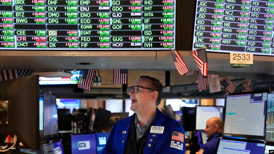 Traders work on the floor at the New York Stock Exchange in New York, Nov. 10, 2022.