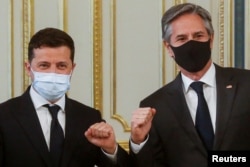 FILE - U.S. Secretary of State Antony Blinken and Ukrainian President Volodymyr Zelenskiy meet in Kyiv, Ukraine, May 6, 2021.