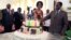 Zimbabwean President Robert Mugabe (R) and his wife Grace cut his birthday cake in Harare, Feb. 22, 2016. Staff in the President's office organized a surprise birthday celebration ahead of Saturday's birthday bash.