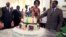 Zimbabwean President Robert Mugabe (R) and his wife Grace cut his birthday cake in Harare, Feb. 22, 2016. Staff in the President's office organized a surprise birthday celebration ahead of Saturday's birthday bash.