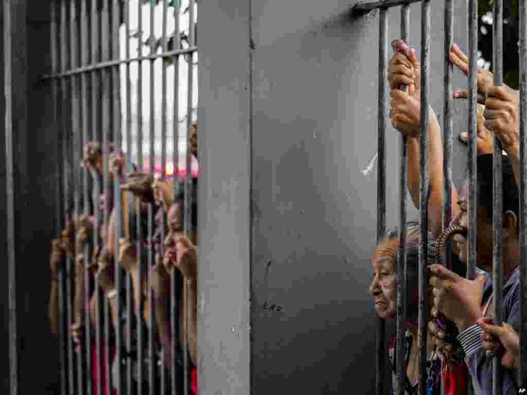 Relatives wait for information following a riot that ended with at least four prisoners killed inside Desembargador Raimundo Vidal Pessoa Public Jail in Manaus, Amazonas, Brazil, Jan. 8, 2017.