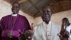 O arcebispo Daniel Deng Bul, da Igreja Episcopal (à Esquerda), votando ao lado do arcebispo católico, Paulino Lukudu Loro