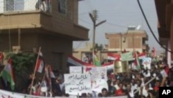 Demonstrators protesting against Syria's President Bashar al-Assad march through the streets after Friday's Prayers in Amude, September 30, 2011.
