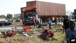 The wreckage of a bus and a truck that collided head on at Migaa area near Salgaa along the Nakuru- Eldoret Highway, Kenya, Dec. 31,2017. 